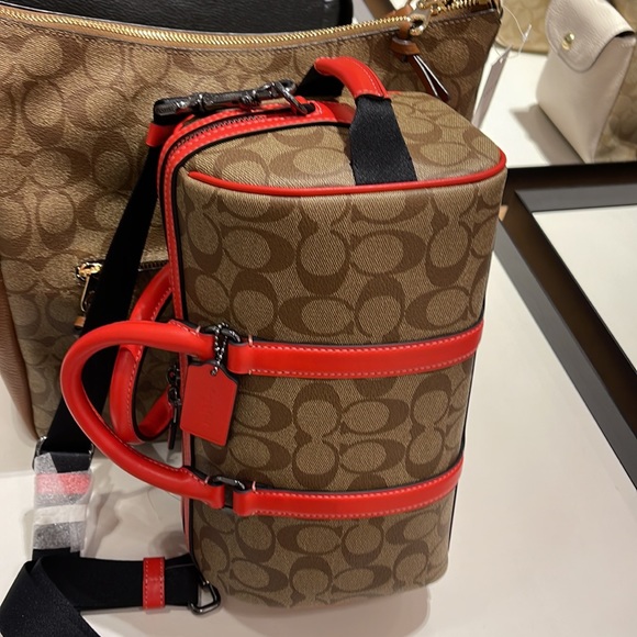 Coach men's Venturer Crossbody 27 In Colorblock Signature Canvas
QB/Khaki/Miami - Picture 9 of 16